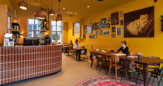 Start your day with a coffee in the colourful bar © Taco Van Der Werf