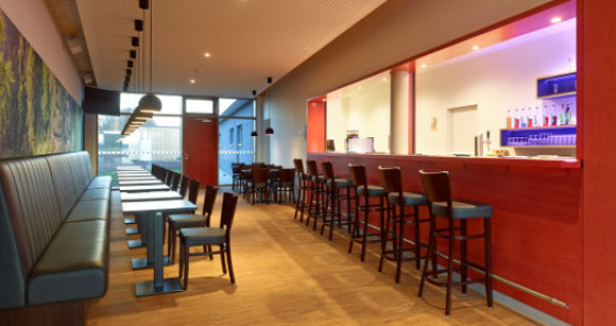 Enjoy a drink at the bar of the youth hostel