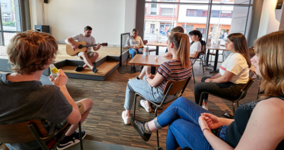 Small scene available for unplugged concerts or karaoke